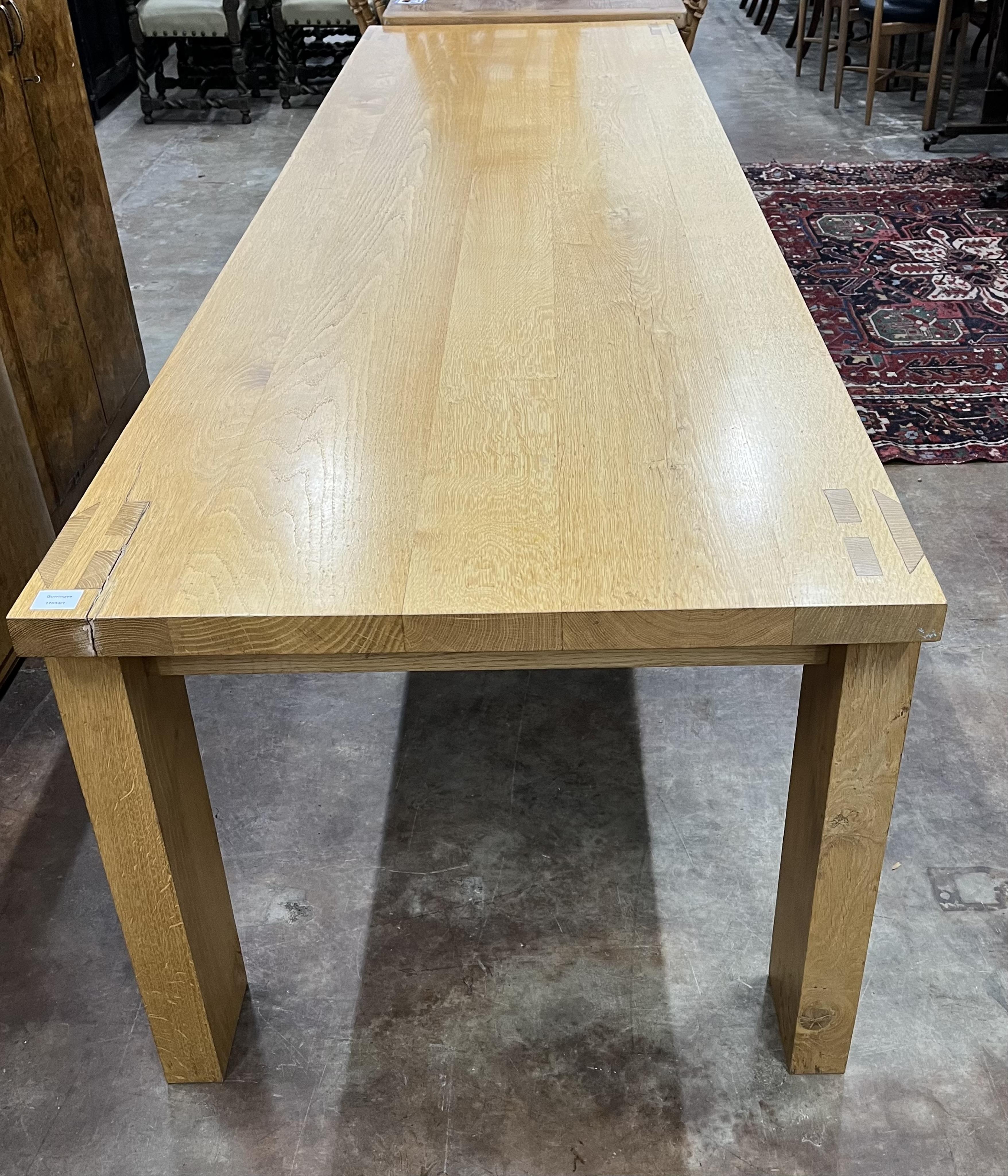 A Contemporary oak rectangular dining table, width 300cm, depth 84cm, height 74cm. Condition - fair